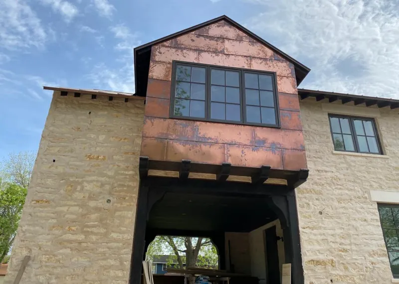 Copper metal panel facade on a stone building for Metal Roof Coating in Murphy